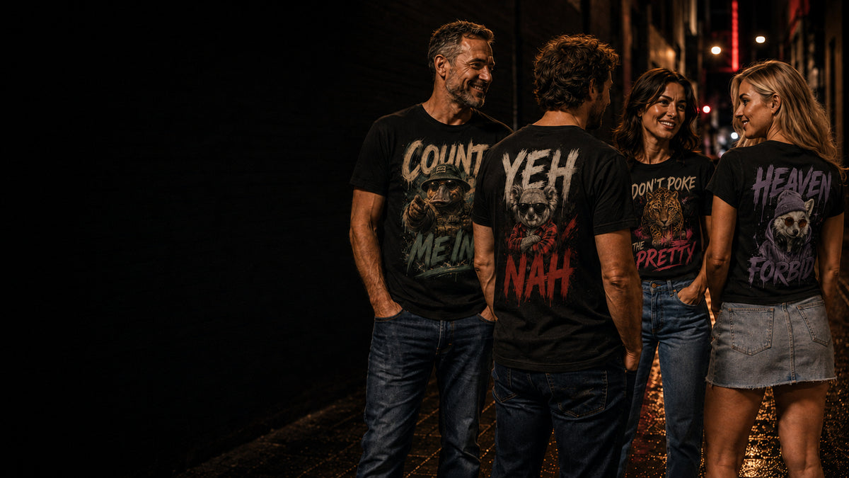 Four people wearing KRED Threads graphic tees on a night street in Australia