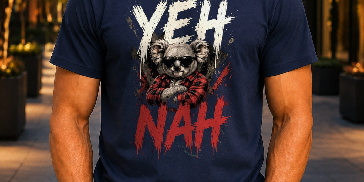 Man wearing a navy KRED Threads Yeh Nah graphic tee