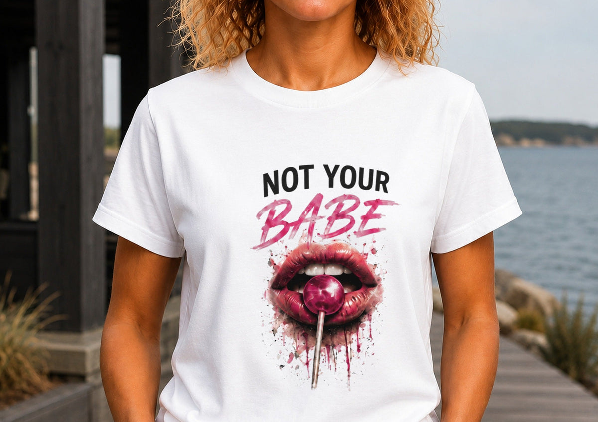 Woman wearing a white KRED Threads Not Your Babe graphic tee