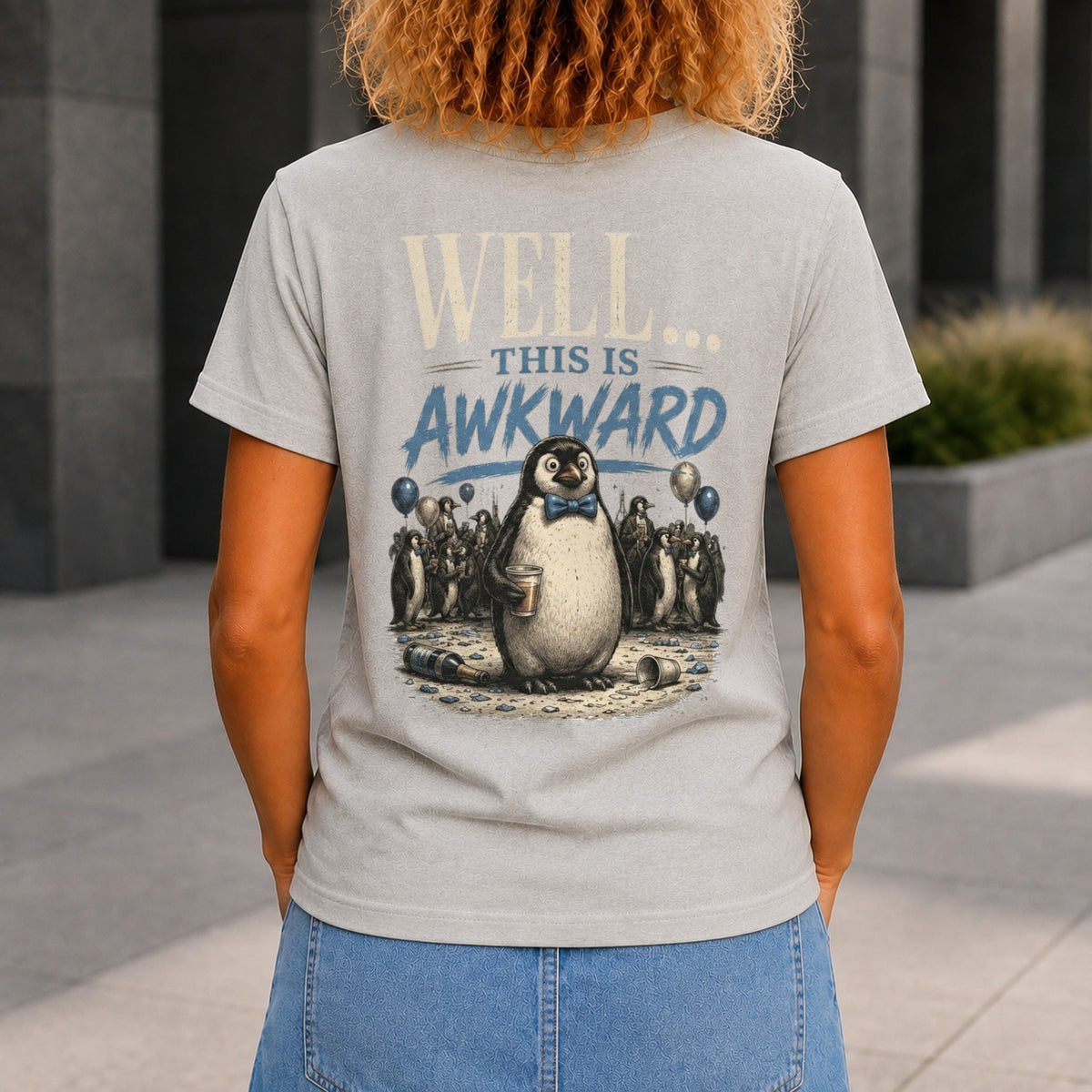 Well... This Is Awkward graphic printed on the back of a grey marble KRED Threads premium tee