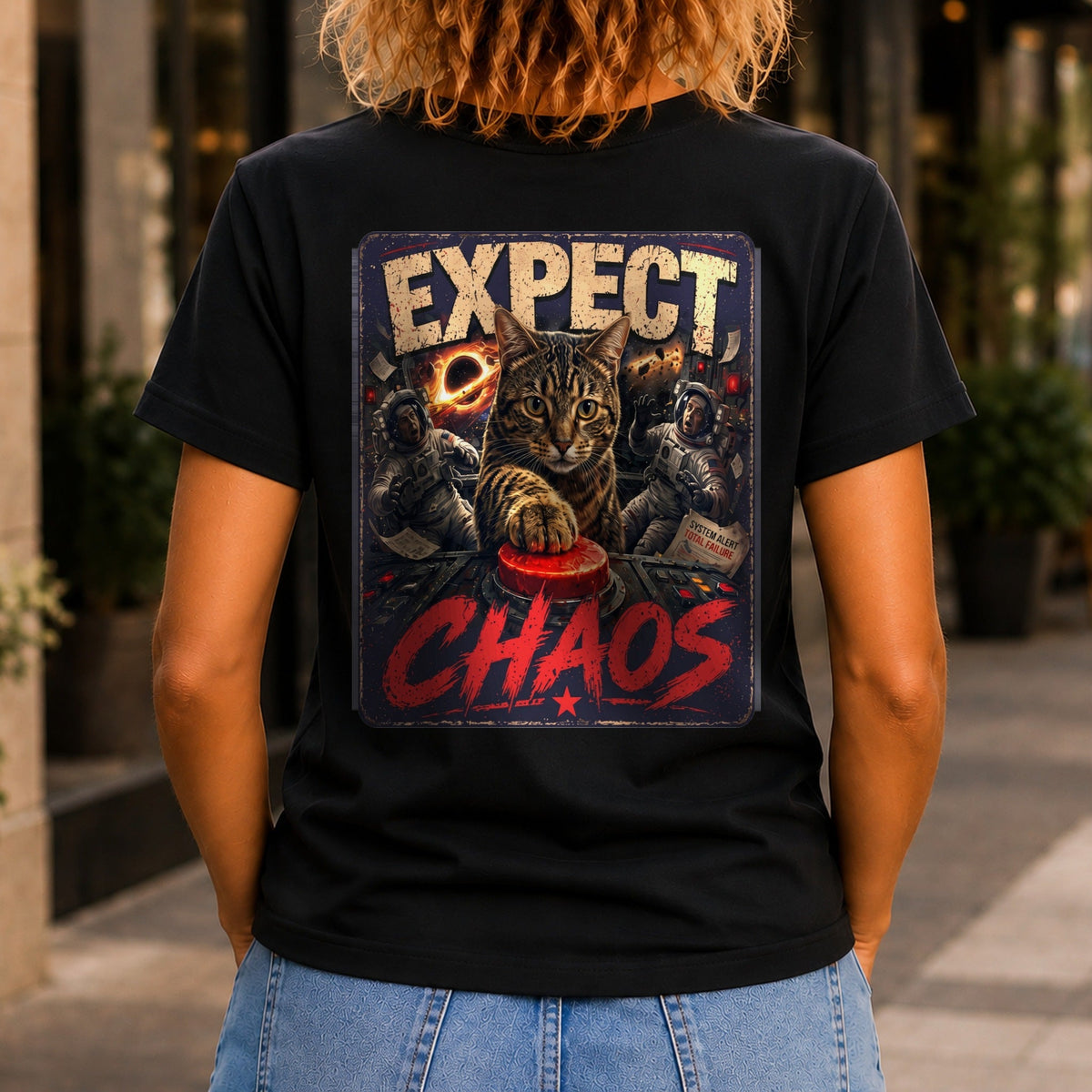 Expect Chaos graphic printed on the back of a black KRED Threads premium tee