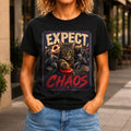 Expect Chaos graphic printed on the front of a black KRED Threads premium tee