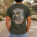 Doing Nothing Is Hard graphic printed on the back of an army KRED Threads premium tee