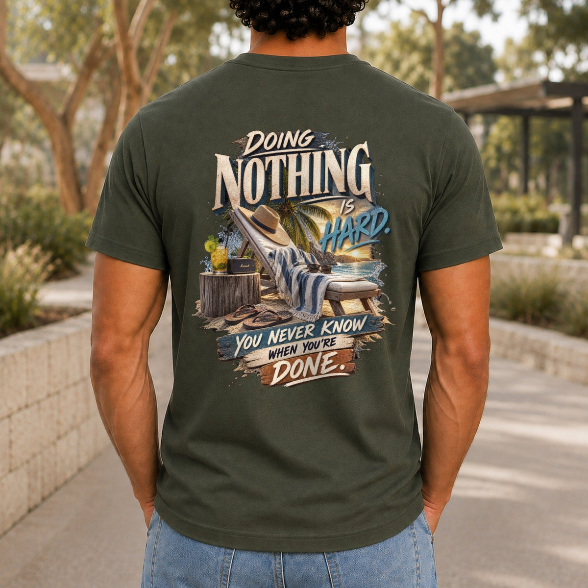 Doing Nothing Is Hard graphic printed on the back of an army KRED Threads premium tee