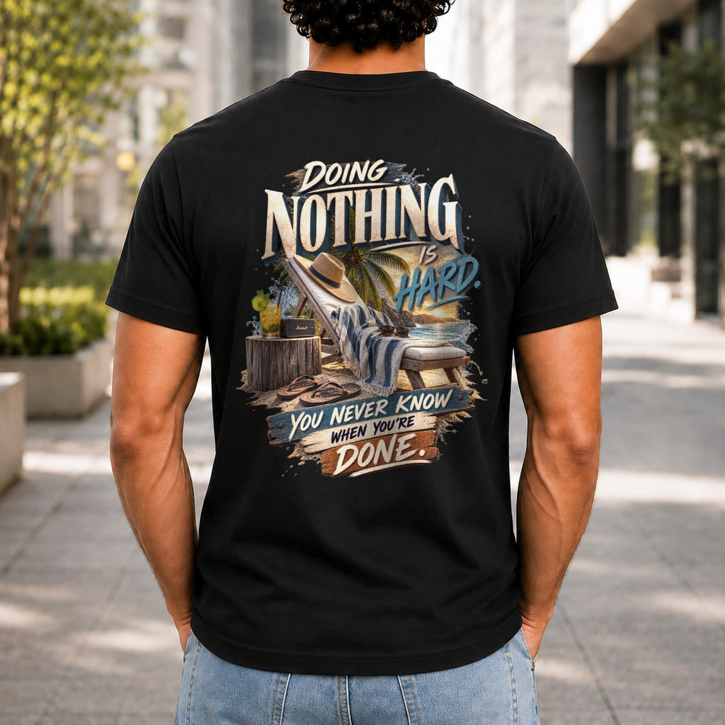 Doing Nothing Is Hard graphic printed on the back of a black KRED Threads premium tee