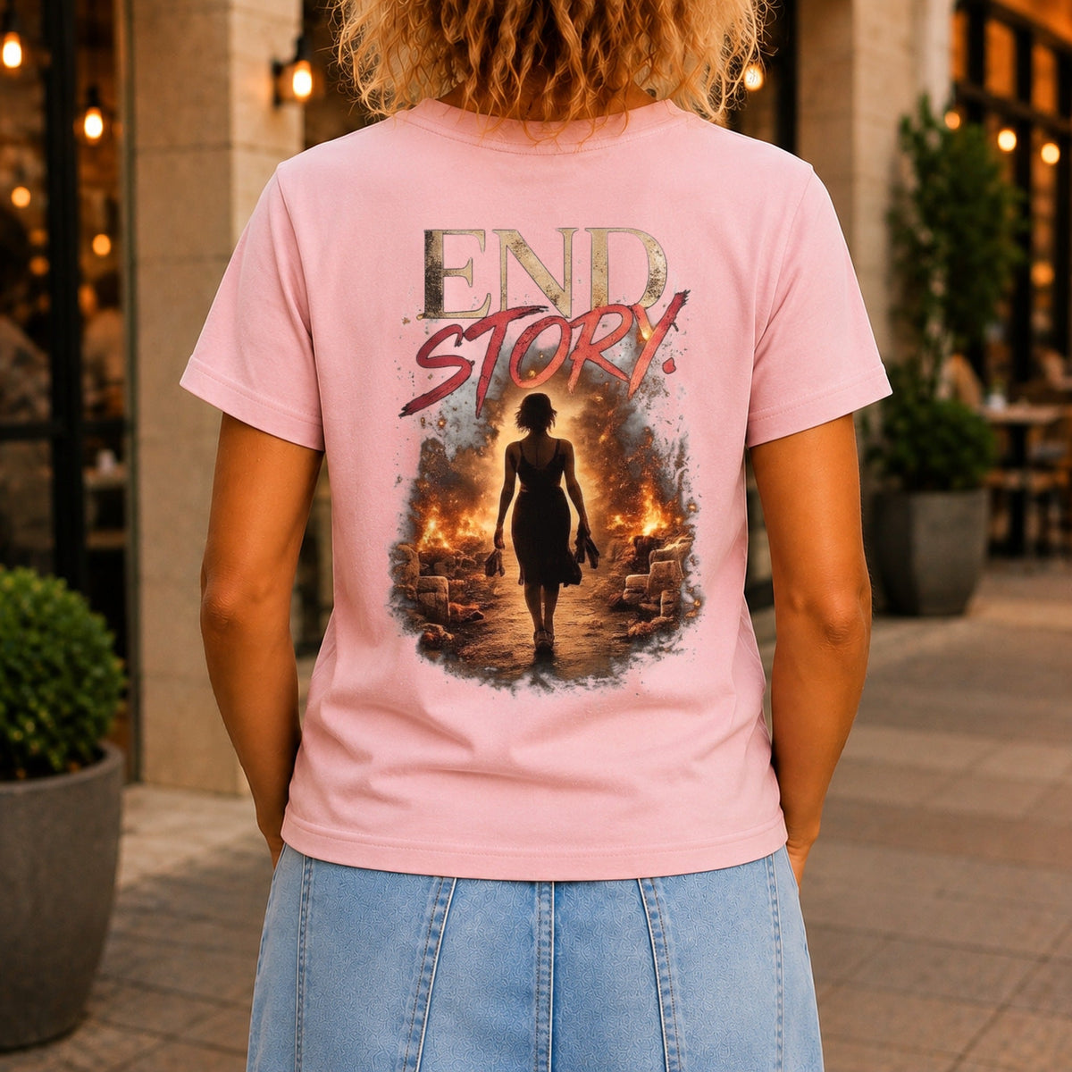 End Story graphic printed on the back of a pink KRED Threads premium tee