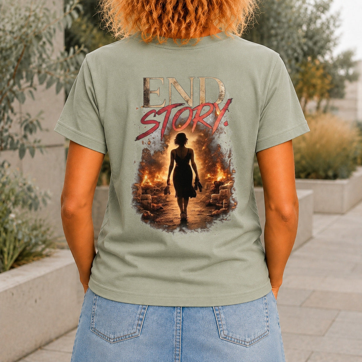 End Story graphic printed on the back of a sage KRED Threads premium tee