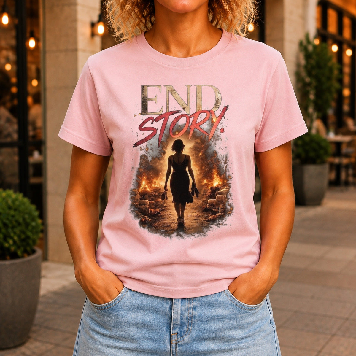 End Story graphic printed on the front of a pink KRED Threads premium tee