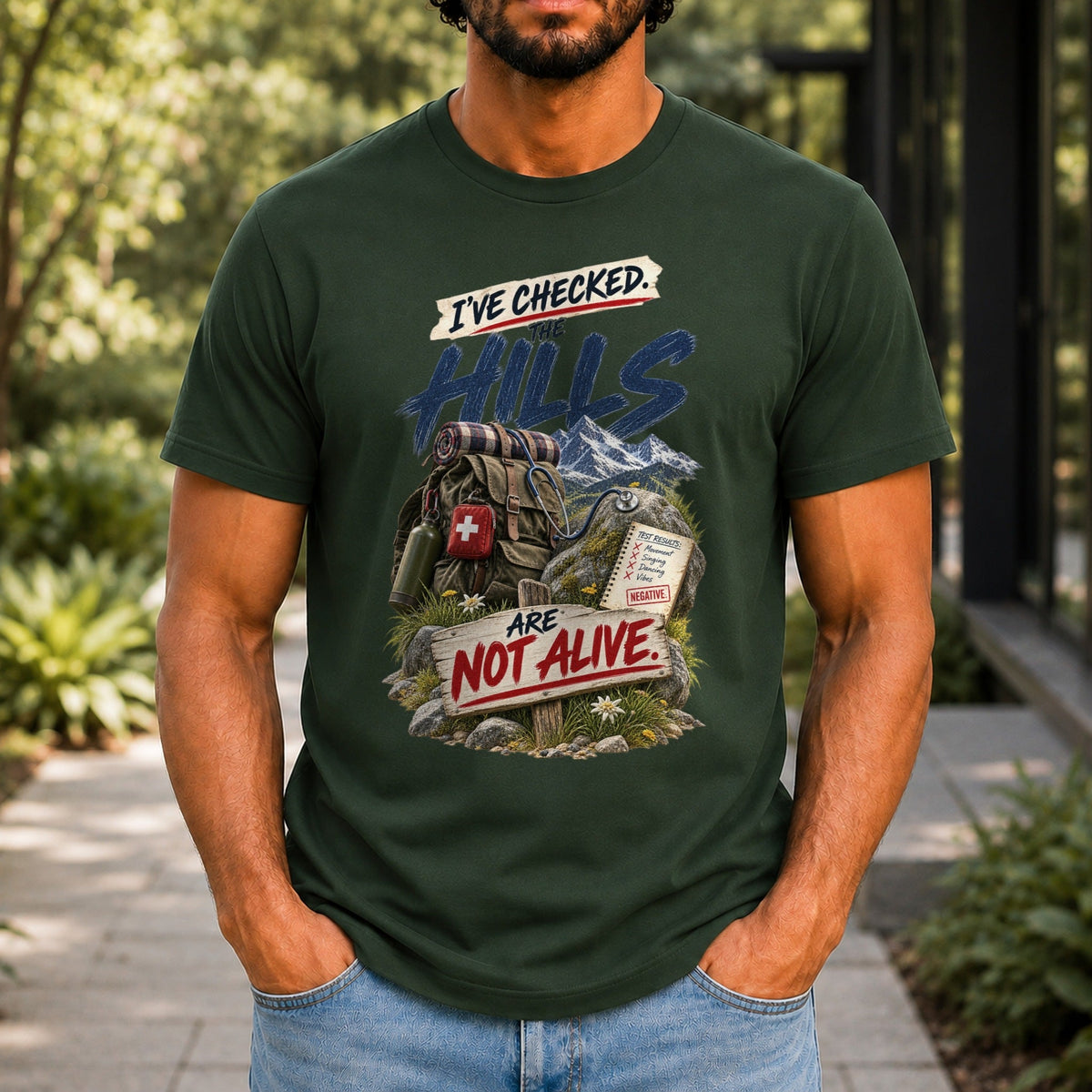 The Hills Are Not Alive graphic printed on the front of a forest green KRED Threads premium tee