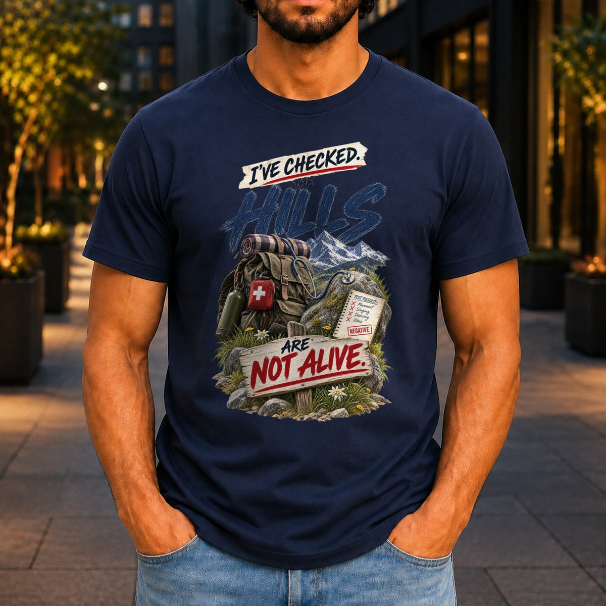 The Hills Are Not Alive graphic printed on the front of a navy KRED Threads premium tee