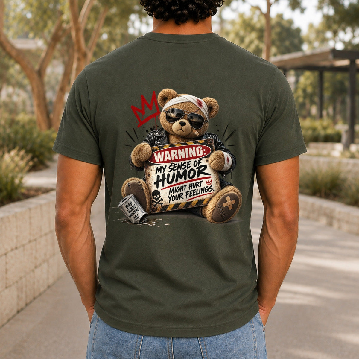My Sense Of Humor Might Hurt Your Feelings graphic printed on the back of an army KRED Threads premium tee