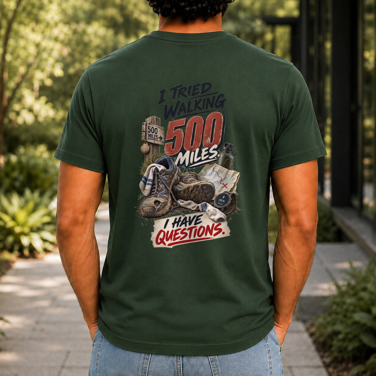 I Tried Walking 500 Miles graphic printed on the back of a forest green KRED Threads premium tee