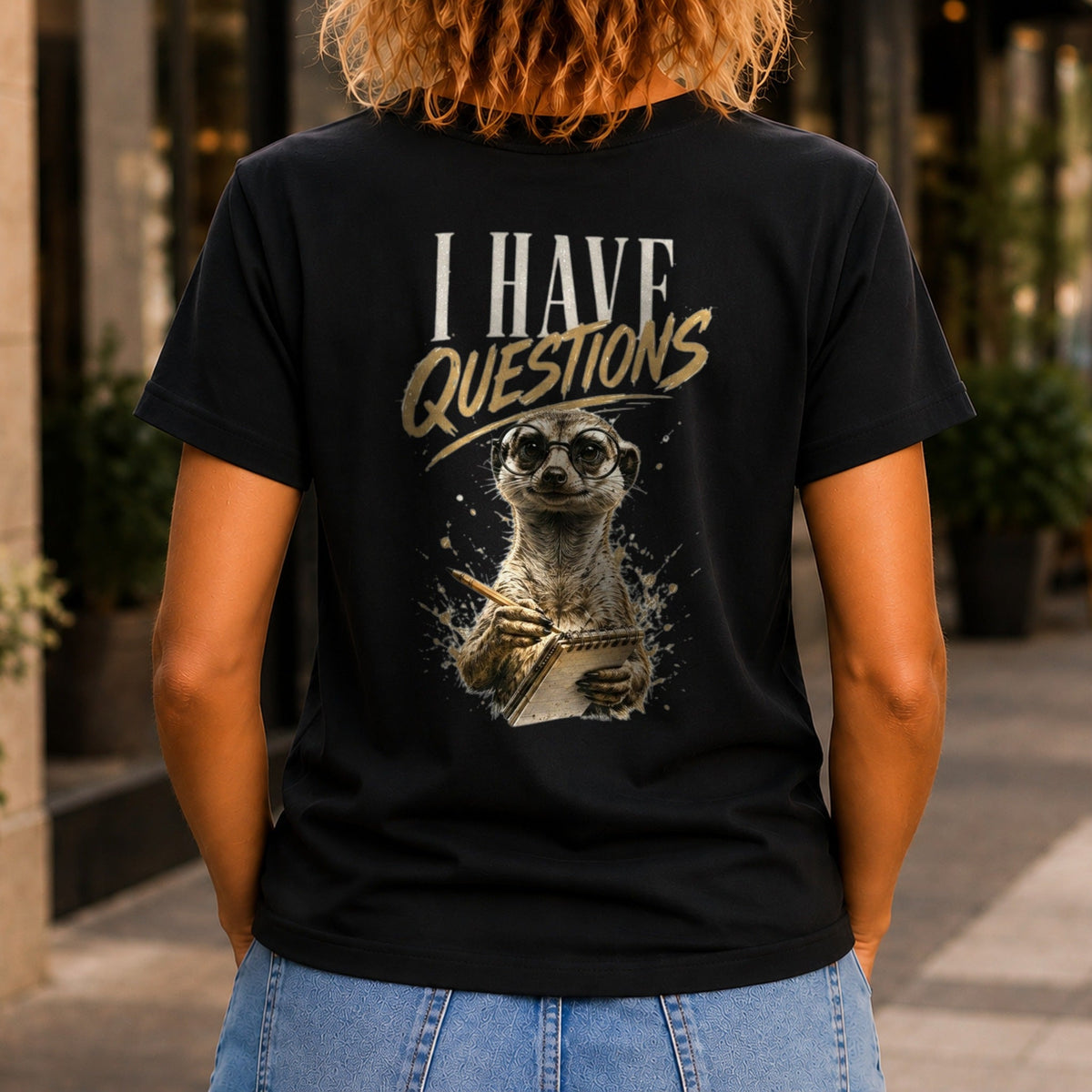 I Have Questions graphic printed on the back of a black KRED Threads premium tee
