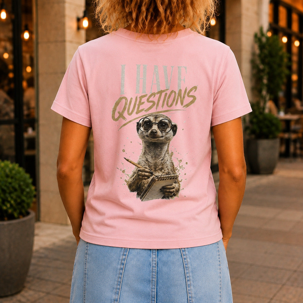 I Have Questions graphic printed on the back of a pink KRED Threads premium tee