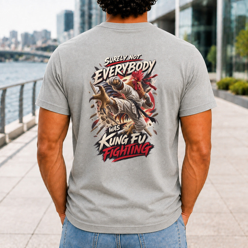 Surely Not Everybody Was Kung Fu Fighting graphic printed on the back of an athletic heather KRED Threads premium tee