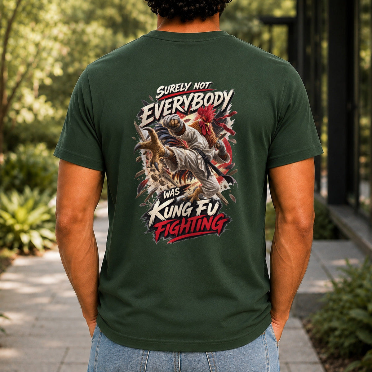 Surely Not Everybody Was Kung Fu Fighting graphic printed on the back of a forest green KRED Threads premium tee