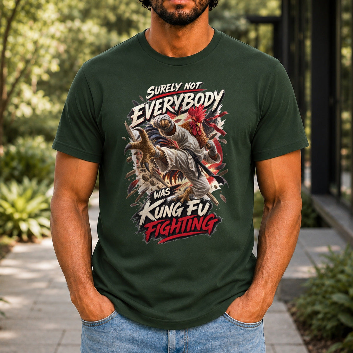 Surely Not Everybody Was Kung Fu Fighting graphic printed on the front of a forest green KRED Threads premium tee