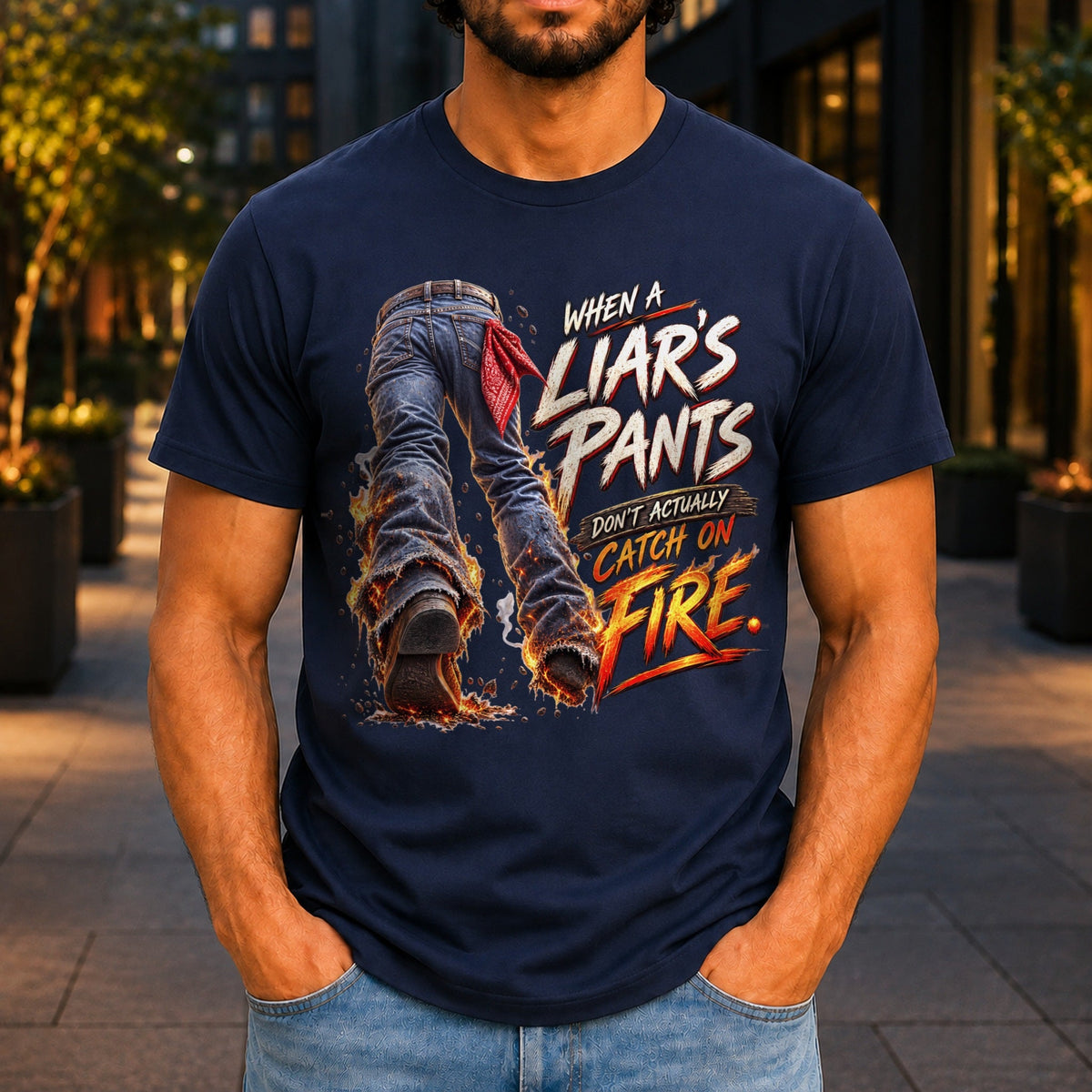 When A Liar's Pants Don't Catch Fire graphic printed on the front of a navy KRED Threads premium tee