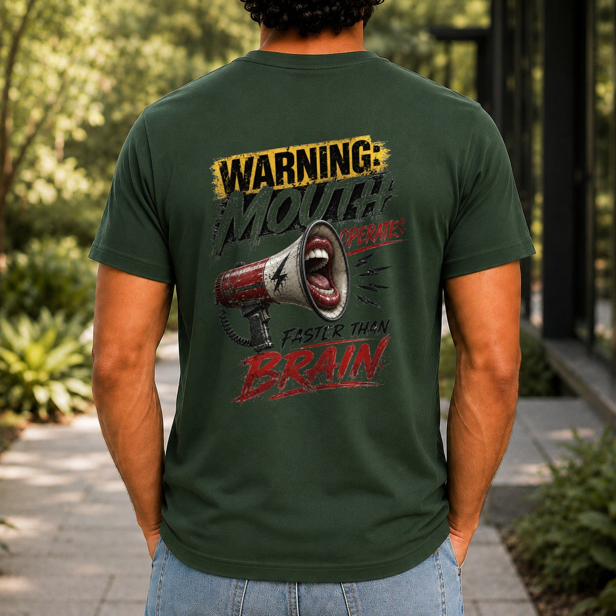 Mouth Operates Faster Than Brain graphic printed on the back of a forest green KRED Threads premium tee