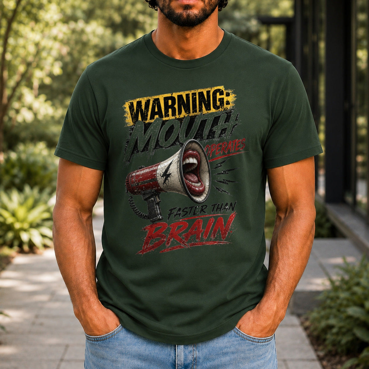 Mouth Operates Faster Than Brain graphic printed on the front of a forest green KRED Threads premium tee