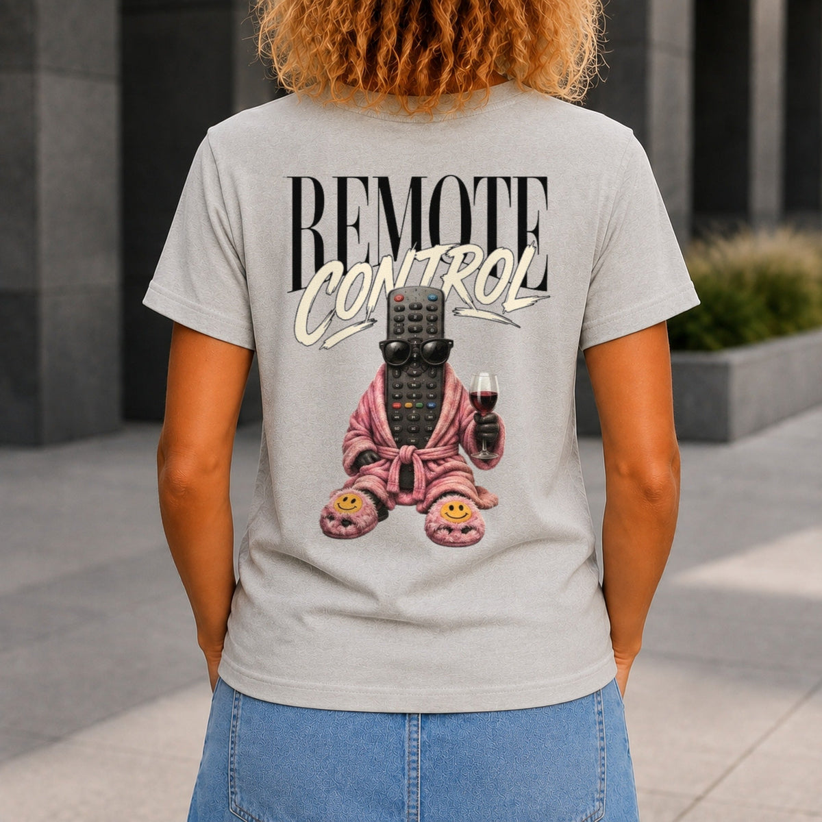 Remote Control graphic printed on the back of a grey marble KRED Threads premium tee