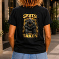 Seats Taken graphic printed on the back of a black KRED Threads premium tee