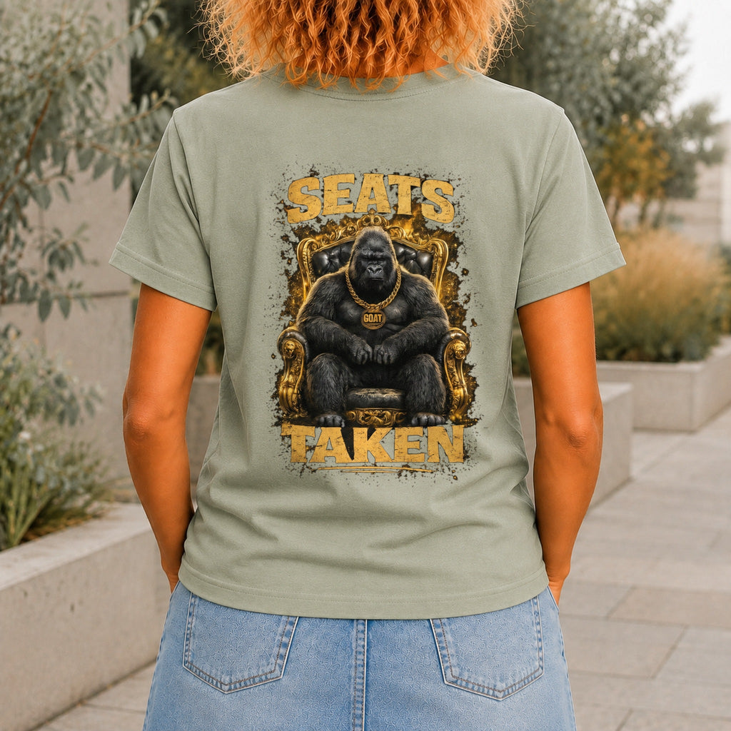Seats Taken graphic printed on the back of a sage KRED Threads premium tee