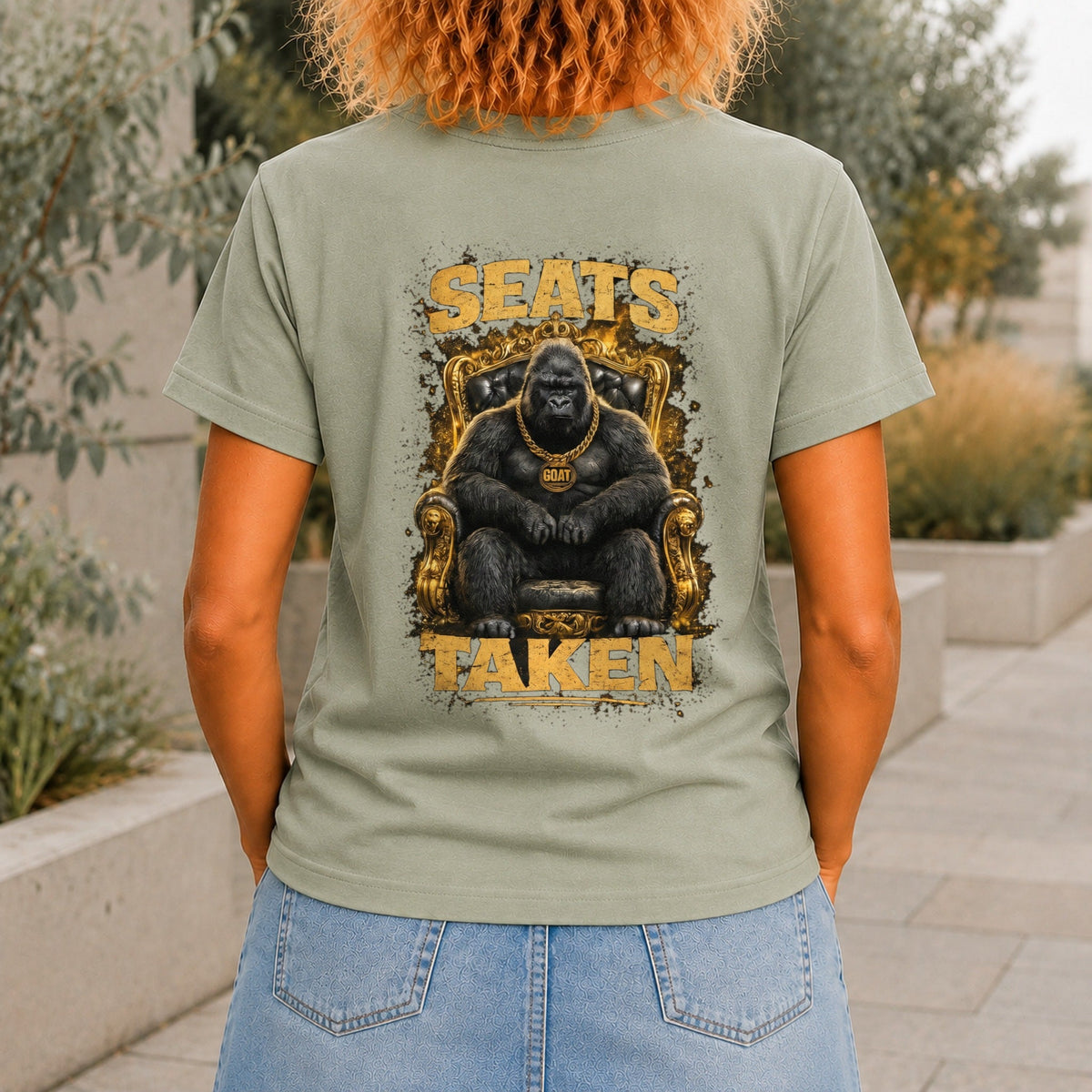 Seats Taken graphic printed on the back of a sage KRED Threads premium tee