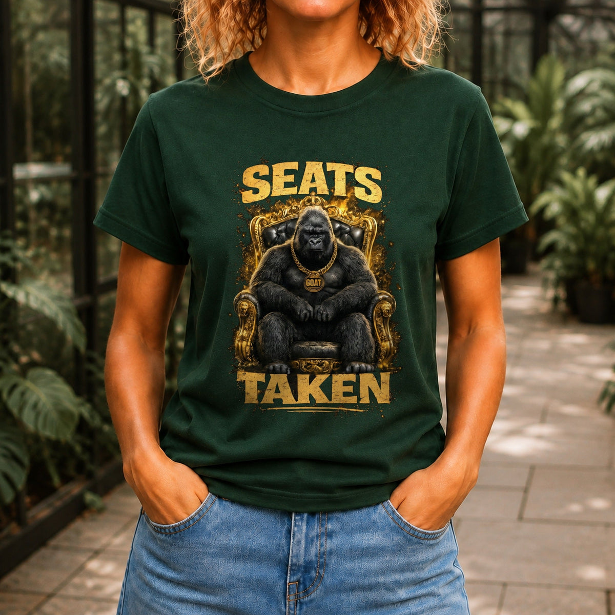 Seats Taken graphic printed on the front of a forest green KRED Threads premium tee
