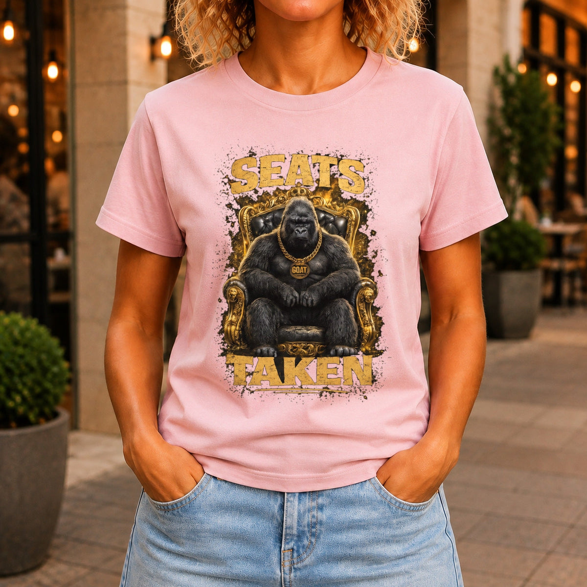 Seats Taken graphic printed on the front of a pink KRED Threads premium tee