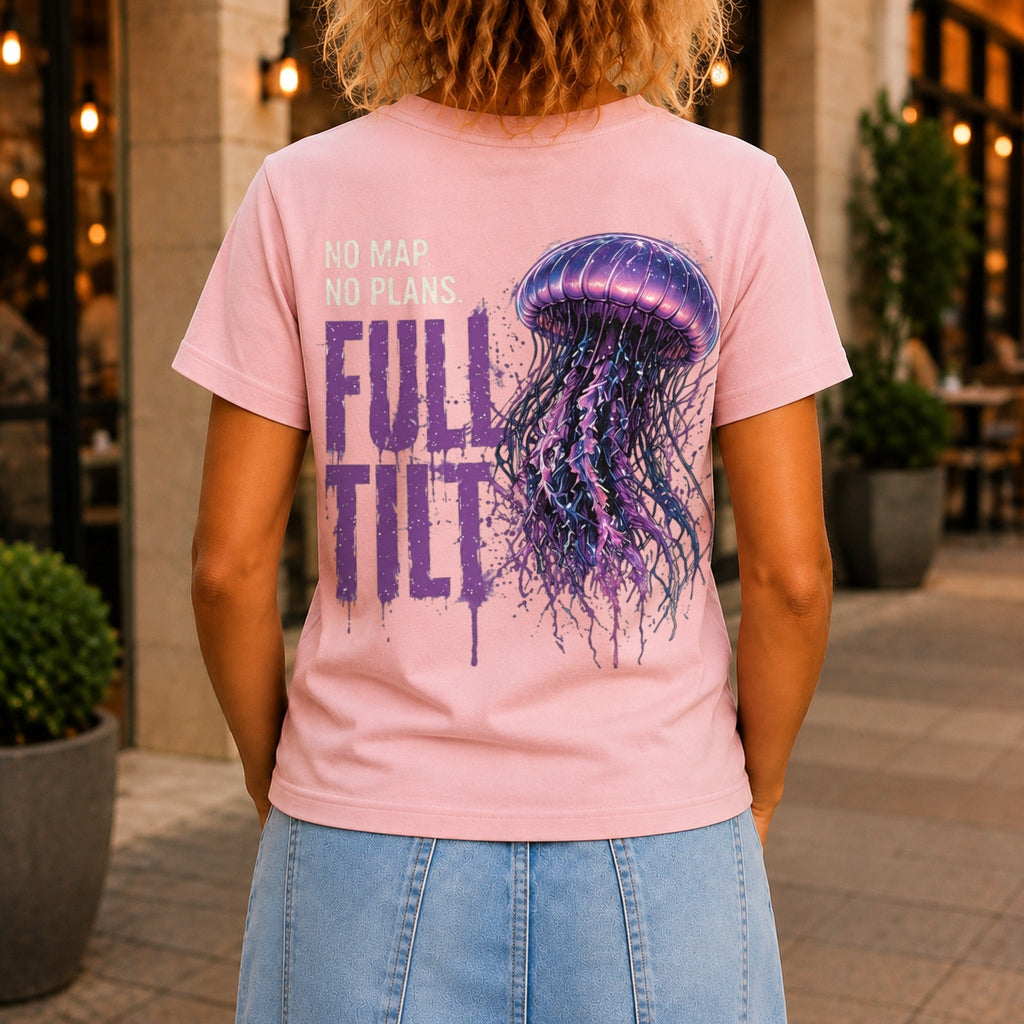 No Map. No Plans. Full Tilt. graphic printed on the back of a pink KRED Threads premium tee