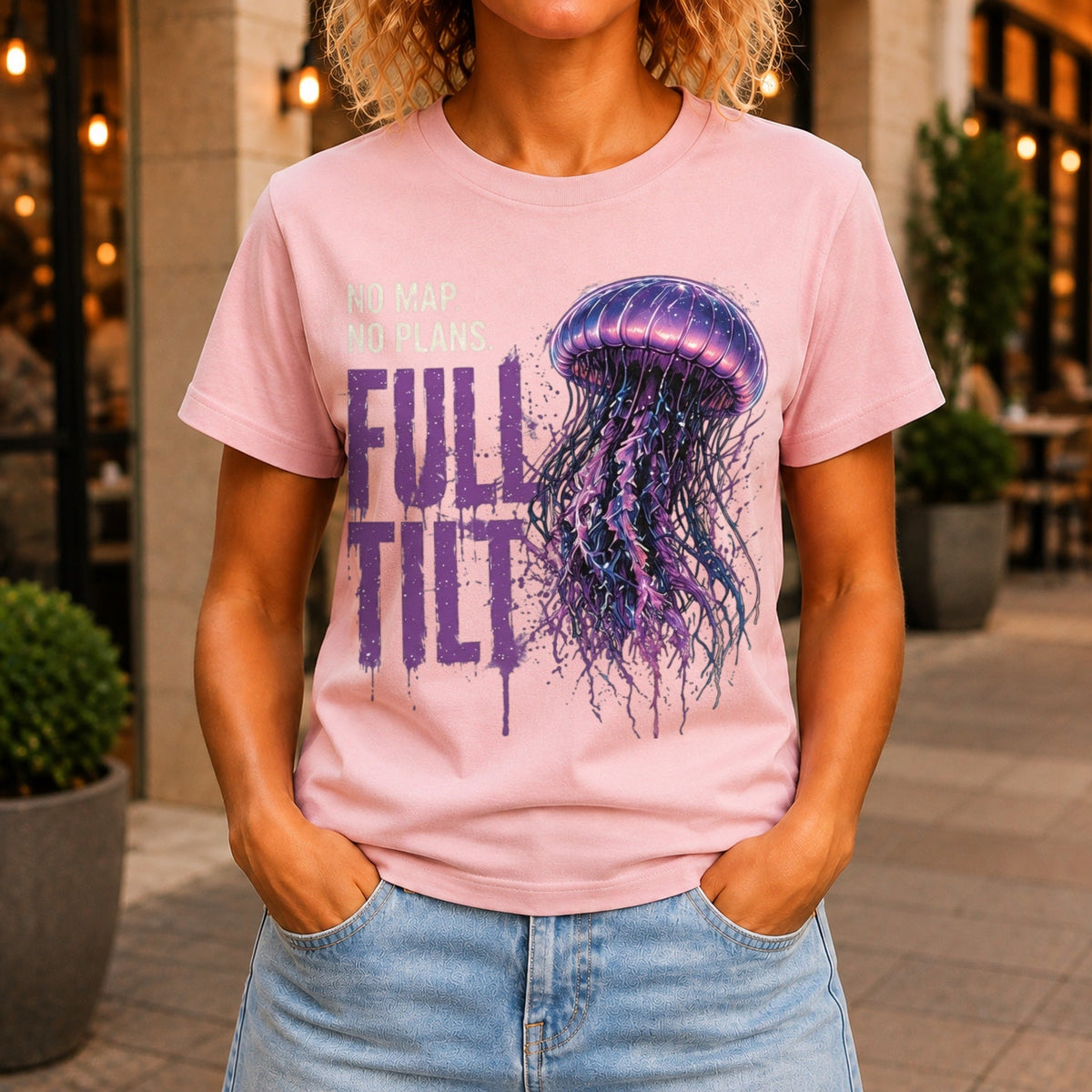 No Map. No Plans. Full Tilt. graphic printed on the front of a pink KRED Threads premium tee