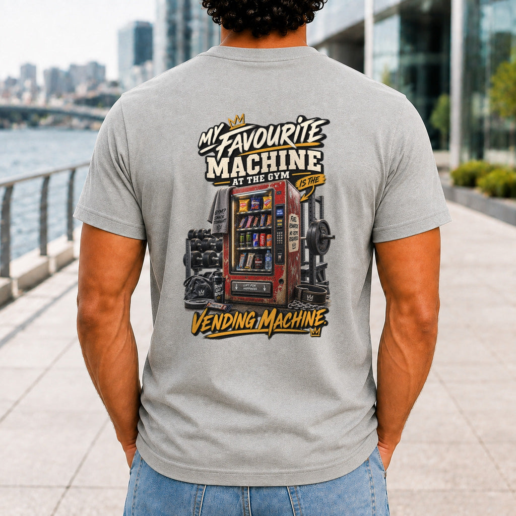 My Favourite Machine At The Gym graphic printed on the back of an athletic heather KRED Threads premium tee