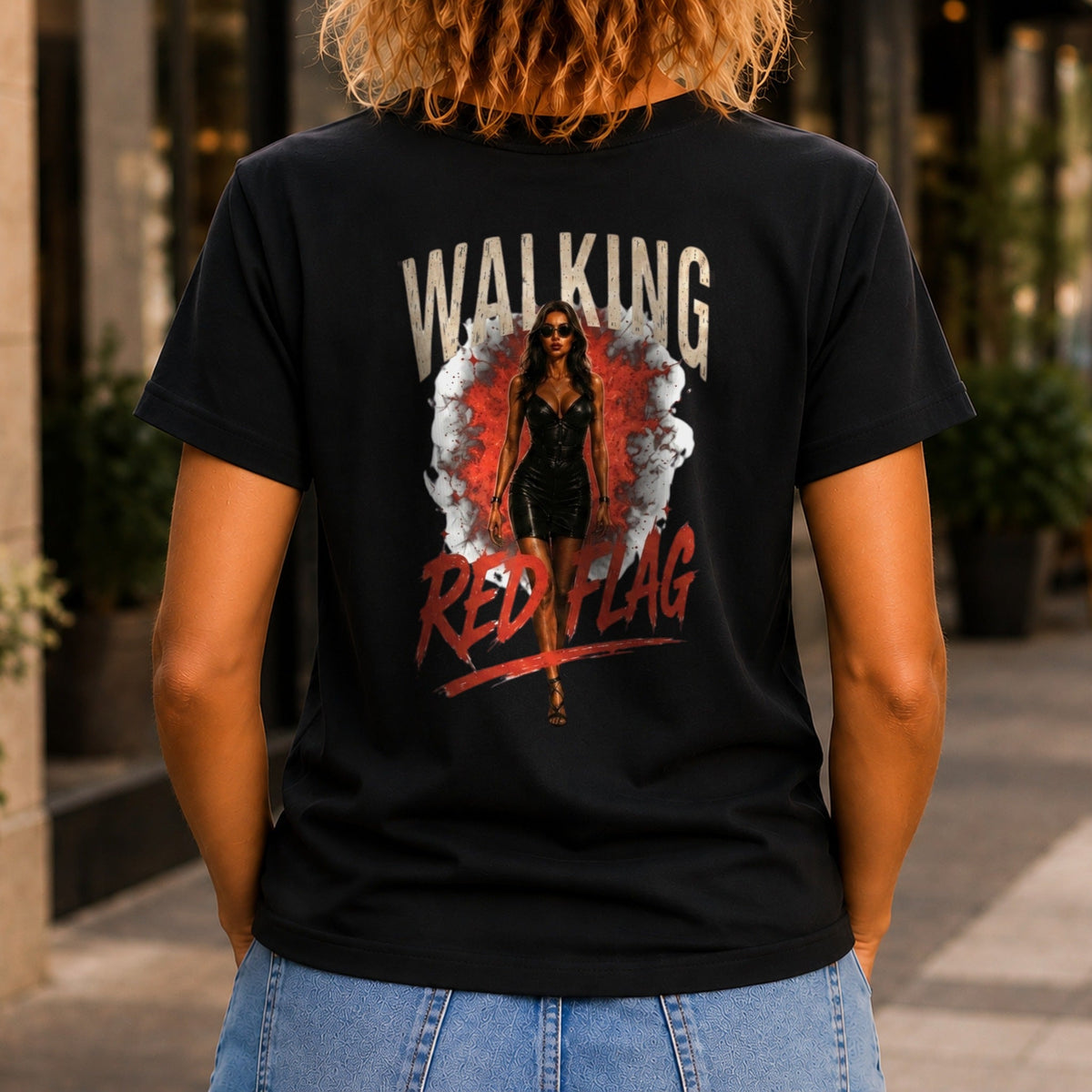 Walking Red Flag graphic printed on the back of a black KRED Threads premium tee