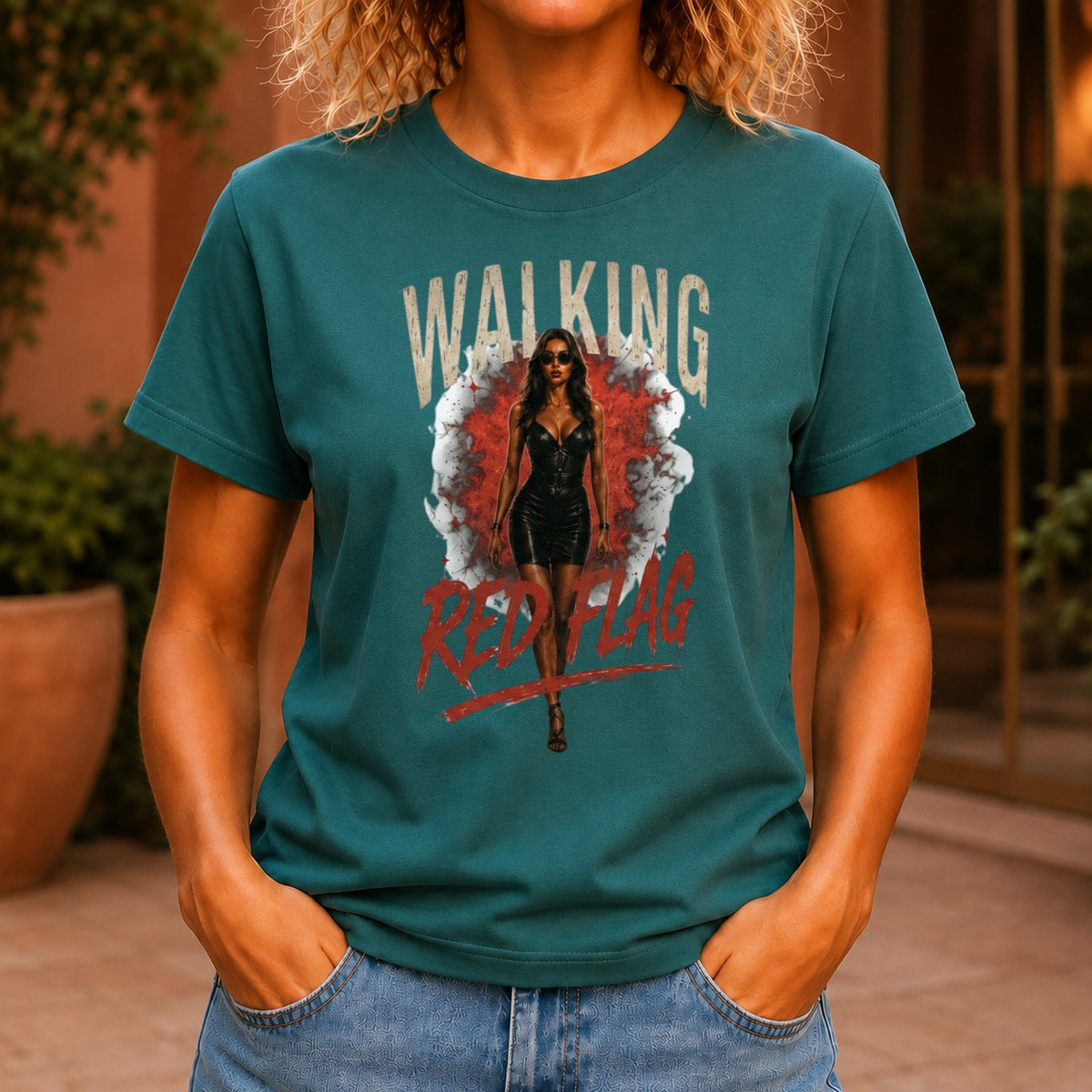 Walking Red Flag graphic printed on the front of a jade KRED Threads premium tee