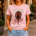 Walking Red Flag graphic printed on the front of a pink KRED Threads premium tee