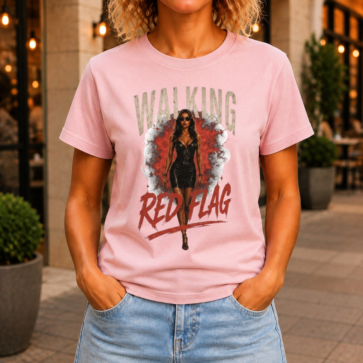 Walking Red Flag graphic printed on the front of a pink KRED Threads premium tee